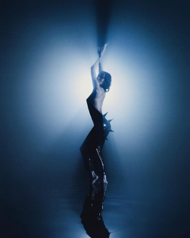 Jesse Jo Stark in a black molded latex gown by Vex Clothing in her Breathe music video