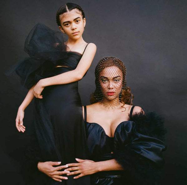 Tyra Banks in a custom black inflatable latex bubble train by Vex Clothing