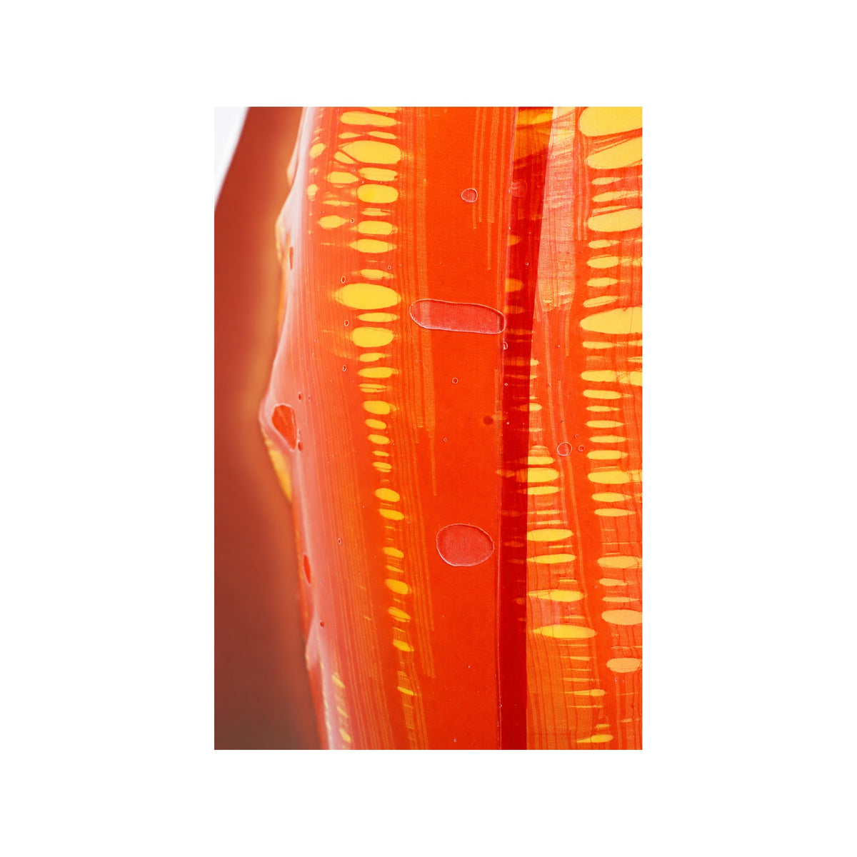 Close-up of hand-marbled Orange Red and yellow transparent nylon latex surface — Vex Clothing