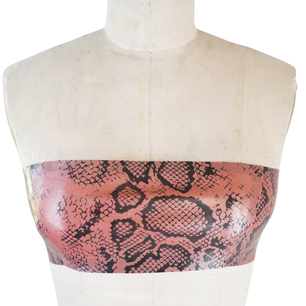 A dress form displays a Vex Clothing, INC pink and black snakeskin-patterned bandeau top against a white background, perfect for showcasing under a bold Ready to Ship Banner.