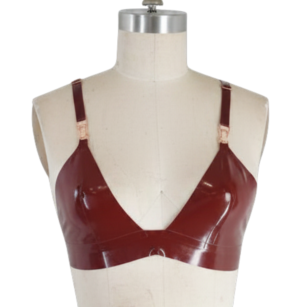 A glossy maroon bralette by Vex Clothing, INC is shown on a dress form against a white background. Ready to ship, it features thin straps, metallic hardware with an accent bar detail, and a deep V neckline.
