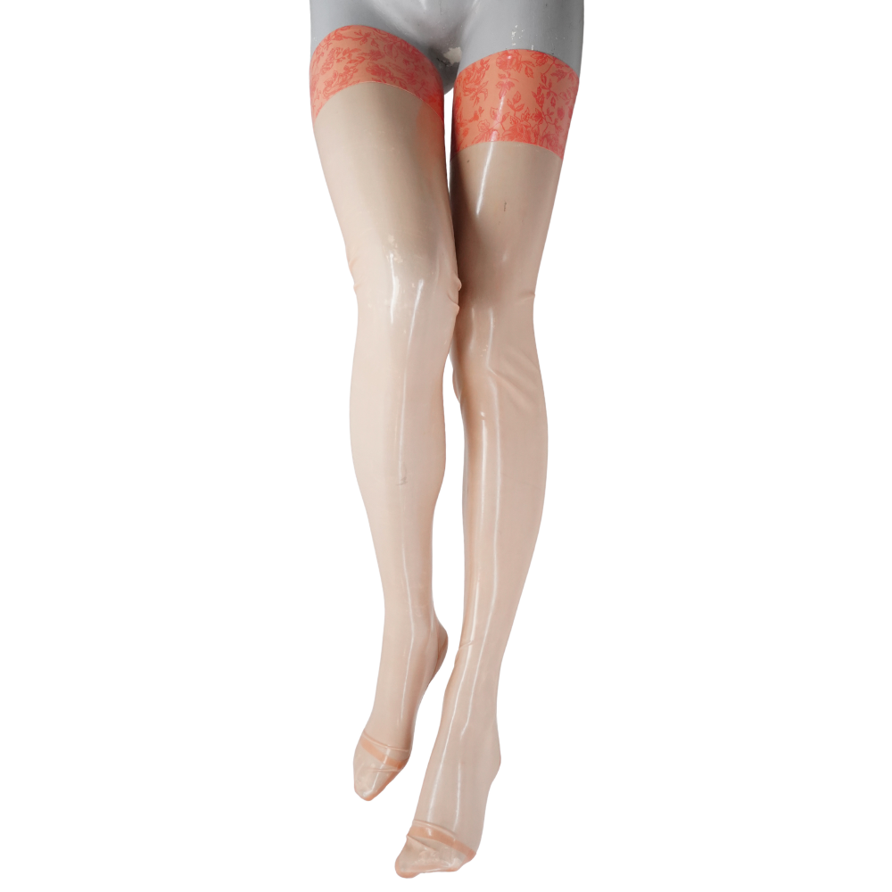 A mannequin models Vex Latex sheer, shiny nude thigh-high stockings with a coral-pink lace band, legs crossed at the ankles. Displayed on a crisp white background—ideal for your Ready to Ship Banner.