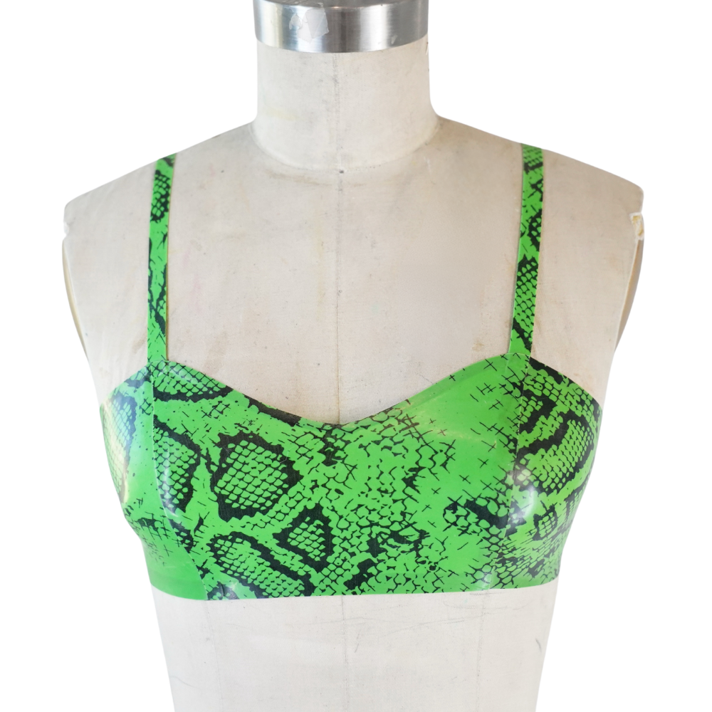A mannequin showcases a Vex Clothing, INC green snake-print crop top with thin straps and a fitted design, set against a plain background—ready to ship and ideal for your next banner or Accent Bar display.