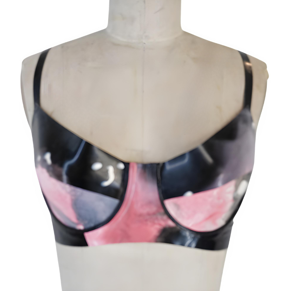 A mannequin torso shows a shiny black and pink latex bra with thin black straps by Vex Inc. | Latex Clothing, displayed against a white background—ideal for your ready to ship banner header.