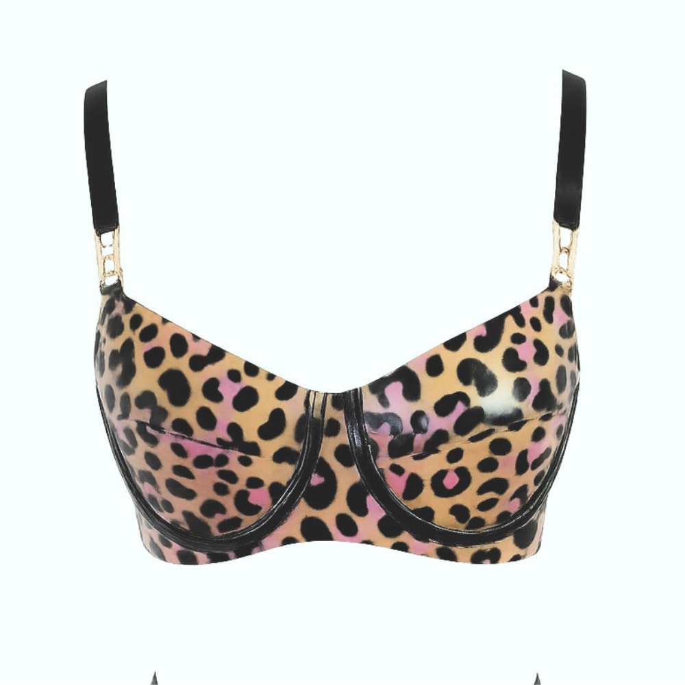 The Vex Inc. Latex Clothing underwire bra features black straps, gold hardware, and tan, black, and pink leopard spots on white latex with a shiny finish for a bold statement.