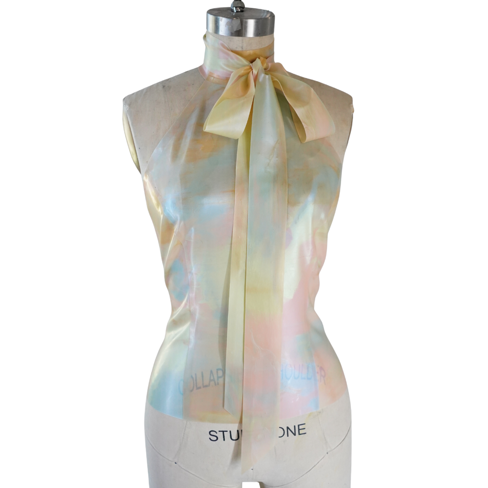 Vex Inc. | Latex Clothing sleeveless pastel satin-look blouse with high neck and long bow tie, shown on a dress form—ready to ship and perfect for elevating your style.
