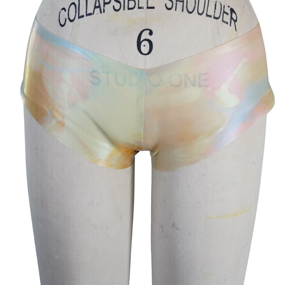 A mannequin torso displays pastel high-waisted shorts with Vex Clothing, INC faintly printed on the front and a COLLAPSIBLE SHOULDER 6 print near the waist—perfect for your Banner Header or Ready to Ship Banner visuals.