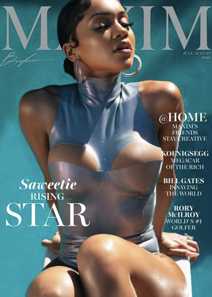 A woman poses confidently on the cover of Maxim magazine, wearing a shiny, form-fitting silver outfit. The magazine features headlines about Saweetie, Bill Gates, Rory McIlroy, and creative friends at home.