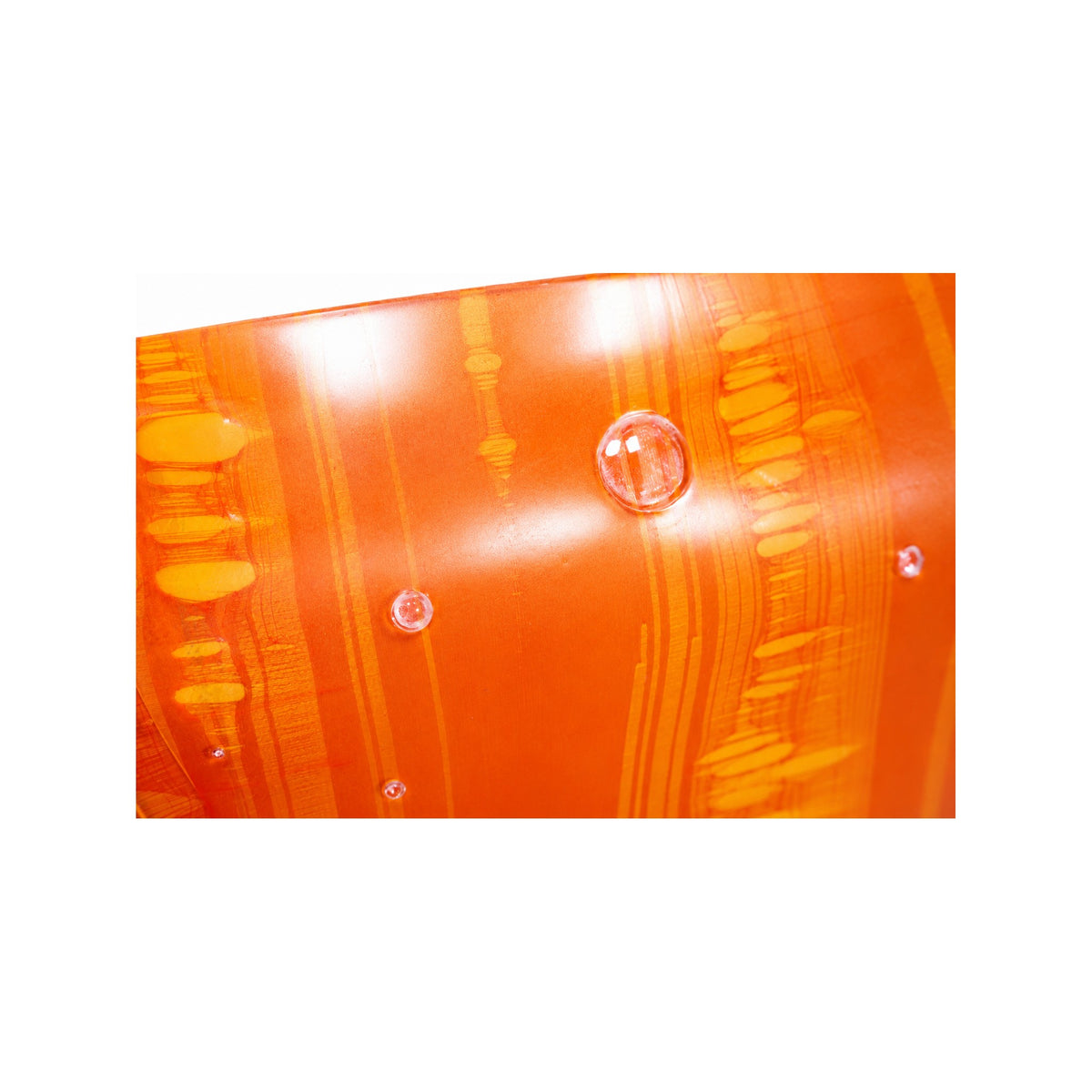 Close-up of hand-marbled Orange Red transparent nylon latex showing streaking and natural inclusions — Vex Clothing