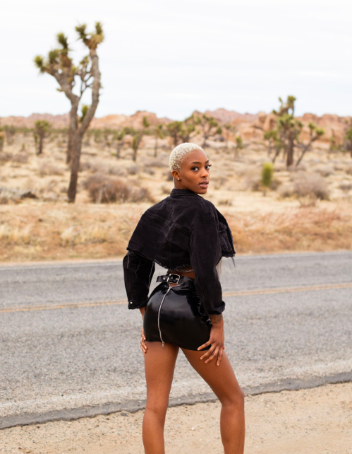 Peekaboo Mini Skirt side view, handmade black latex — Vex Clothing